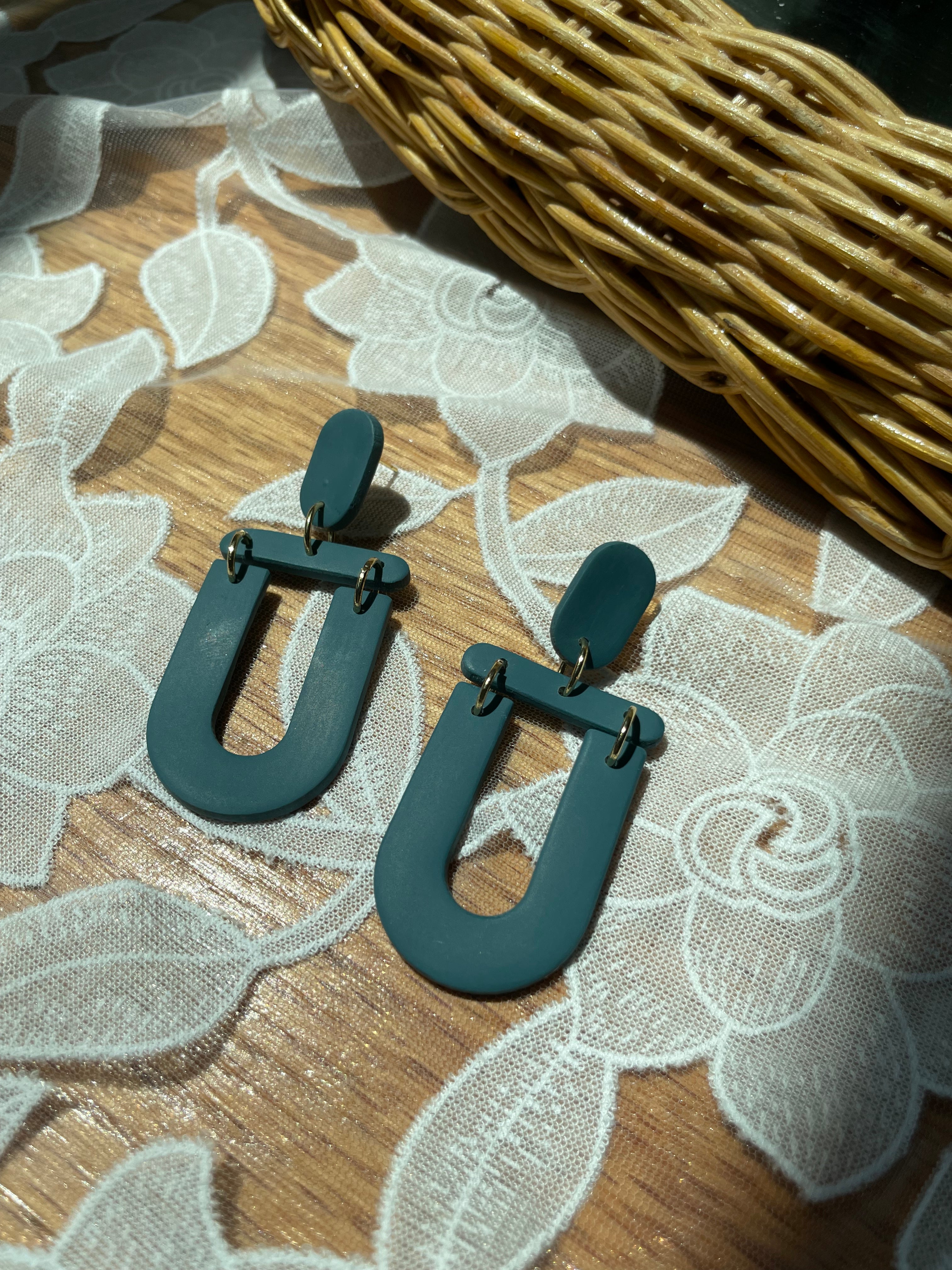 Teal U dangles